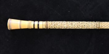 A 19th century marine ivory and whalebone walking cane, the hobnail carved upper section set with