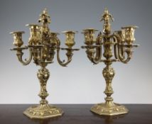 A pair of mid 19th century ormolu five light candelabra, cast throughout with acanthus leaves and