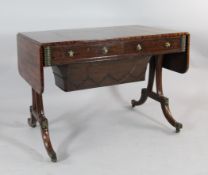 A Regency mahogany `pop up` sofa table, the top sliding forward releasing a sprung stationery box,