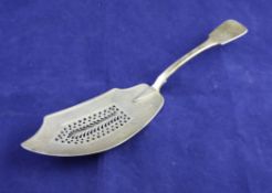 A George IV silver fiddle pattern fish slice, with pierced blade, James Wintle, London, 1824, 12in.