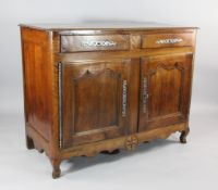 An early 19th century French walnut buffet, with two drawers and two cupboard doors, on cabriole