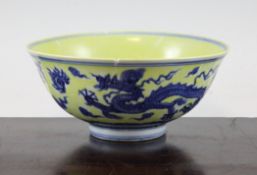 A Chinese blue and white yellow glazed `dragon and phoenix` bowl, Xuande six character mark, 7.5in.