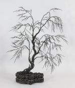 An unusual Chinese iron model of a tree, with wood stand, late 19th / early 20th century, the