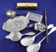 A pair of late Victorian silver spoons, with cusped floral embossed bowls and foliate engraved