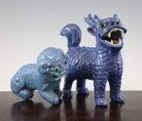 A Chinese robin`s egg glazed figure of a lion-dog, early 20th century, 6.5in. and a larger blue