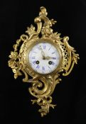 A French Louis XVI style gilt metal Cartel clock, with enamelled Roman dial and movement striking on