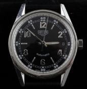 A gentleman`s stainless steel Heuer automatic wrist watch, the black dial with Arabic and baton