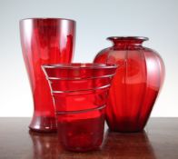 Three large Whitefriars red glass vases, mid 20th century, of lobed ovoid form, spiral moulded