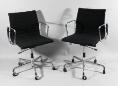 A near pair of Charles and Ray Eames office chairs from the Aluminium Group series with chromed