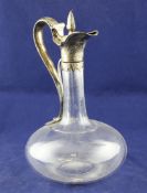 An early Victorian silver mounted glass claret jug, of bulbous form with fluted neck, the mount