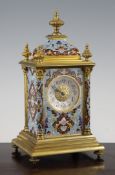 An early 20th century French ormolu and champleve enamel mantel clock, with foliate decorated case