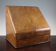 A Victorian burr walnut stationery casket, with two drawers enclosing a fitted interior on plinth