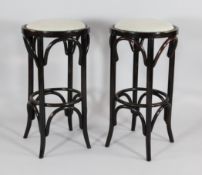 A set of four bentwood stools, with upholstered seats