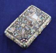 An ornate Russian style silver and polychrome cloisonne enamelled cigarette case, of rounded