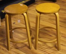 A pair Alvar Aalto model 60 birchwood stools, 2ft 2in.