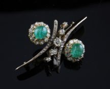 A gold, cabochon emerald and old cut diamond brooch, of symmetrical design, 2.25in.