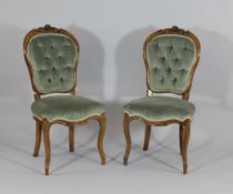 A set of six Victorian carved walnut dining chairs, with upholstered buttonbacks and seats on