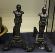 A pair of Carron Falkirk foundry cast iron andirons, modelled as Etruscan warriors, 17.25in.