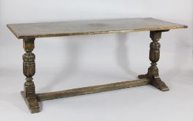 An Elizabethan design oak refectory table, c.1900, with turned baluster columns, on standard spade
