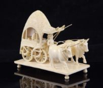 A 19th century Indian carved ivory `John Company` group, Berhampur, Bengal, of a coach and two