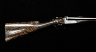 A Lloyds of Lewes 12 bore side by side shot gun, number 3758 with walnut stock