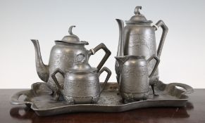 A pewter five piece coffee set, by Gerhardi & Co, c.1900, each piece moulded with holly leaves, tray