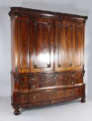 A 19th century Dutch mahogany cupboard, with egg and dart and dentil cornice, above two panelled