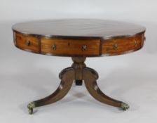 A Regency mahogany and rosewood banded strung top library table, with four real and four dummy