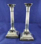 A pair of Victorian silver corinthian column candlesticks, on square bases, with scrolling hare bell