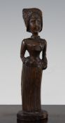 A 19th century French folk art novelty beech figural pipe and stand, modelled as a lady with