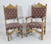 A set of ten 17th century design oak dining chairs, including two with arms, with fleur de lys