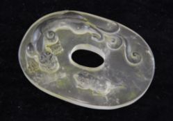 A Chinese rock crystal disc, carved in relief with a chi-dragon and a rat, approx. 3.1in.