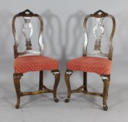 A set of six late 17th century design Dutch carved walnut dining chairs, with pierced serpentine