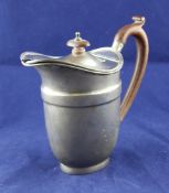A George V silver hot milk jug, with banded shoulder and wooden handle, H.S Benzie, London, 1931,