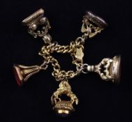 A Victorian 15ct gold curblink charm bracelet, hung with five Regency and later gold or gilt mounted