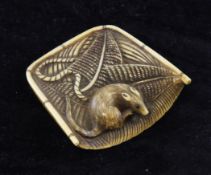 A Japanese ivory netsuke modelled as a rat caught in a fisherman`s nets, Meiji period, the rat