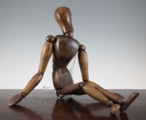A French stained beech artist`s lay figure, 25in.