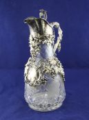 A late Victorian plate mounted cut glass claret jug, with basket weave textured spout and rustic