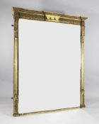 A Victorian Etruscan style carved giltwood and gesso overmantel mirror, decorated with stylised