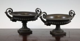 A pair of 19th century bronze tazza, with twin Bacchus mask handles, on square bases, 5.5in.