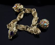 A 20th century Italian 18ct gold and gem set charm bracelet, with textured links and charms set with