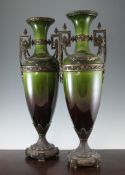 A large pair of late 19th century gilt metal mounted green glazed pottery amphora vases, cast with