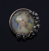 A late Victorian gold and diamond set circular brooch with inset painted portrait of a lady, the