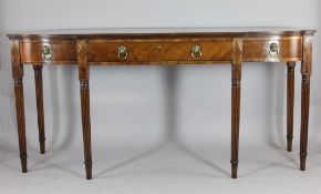 A Regency mahogany breakfront serving table, with three drawers, on turned and fluted tapered