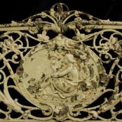 A Coalbrookdale `Medallion` pattern cast iron garden bench, cast with an oval cartouche decorated