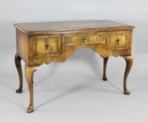 A Queen Anne style herringbone inlaid walnut side table, with three drawers, on cabriole legs and