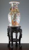 A Chinese Canton decorated famille rose baluster vase, late 19th century, typically painted with