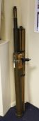 A large mid 19th century brass two drawer telescope by James Goddard, with later tripod and fitting,