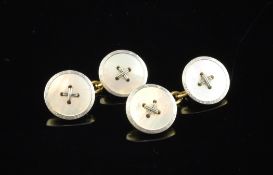 A pair of 18ct gold and mother of pearl circular cufflinks.
