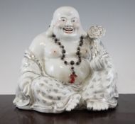 A Chinese gilt decorated seated figure of Budai, 20th century, wearing a rosary of beads,